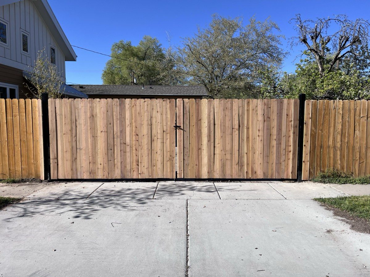 Cedar double drive gate we built across a driveway